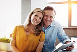 Photo of a couple smiling. Link to Life Stage Gift Planner Under Age 60 Situations.