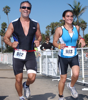 Photo of Glen and his daughter, Annie, share strides during the Santa Barbara Triathlon Titan-lg.jpg