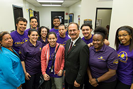 Photo of current president Havidan Rodriguez with students. Link to Gifts That Pay You Income.